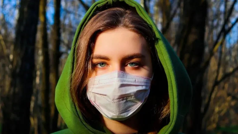 Woman wearing a face mask outdoors